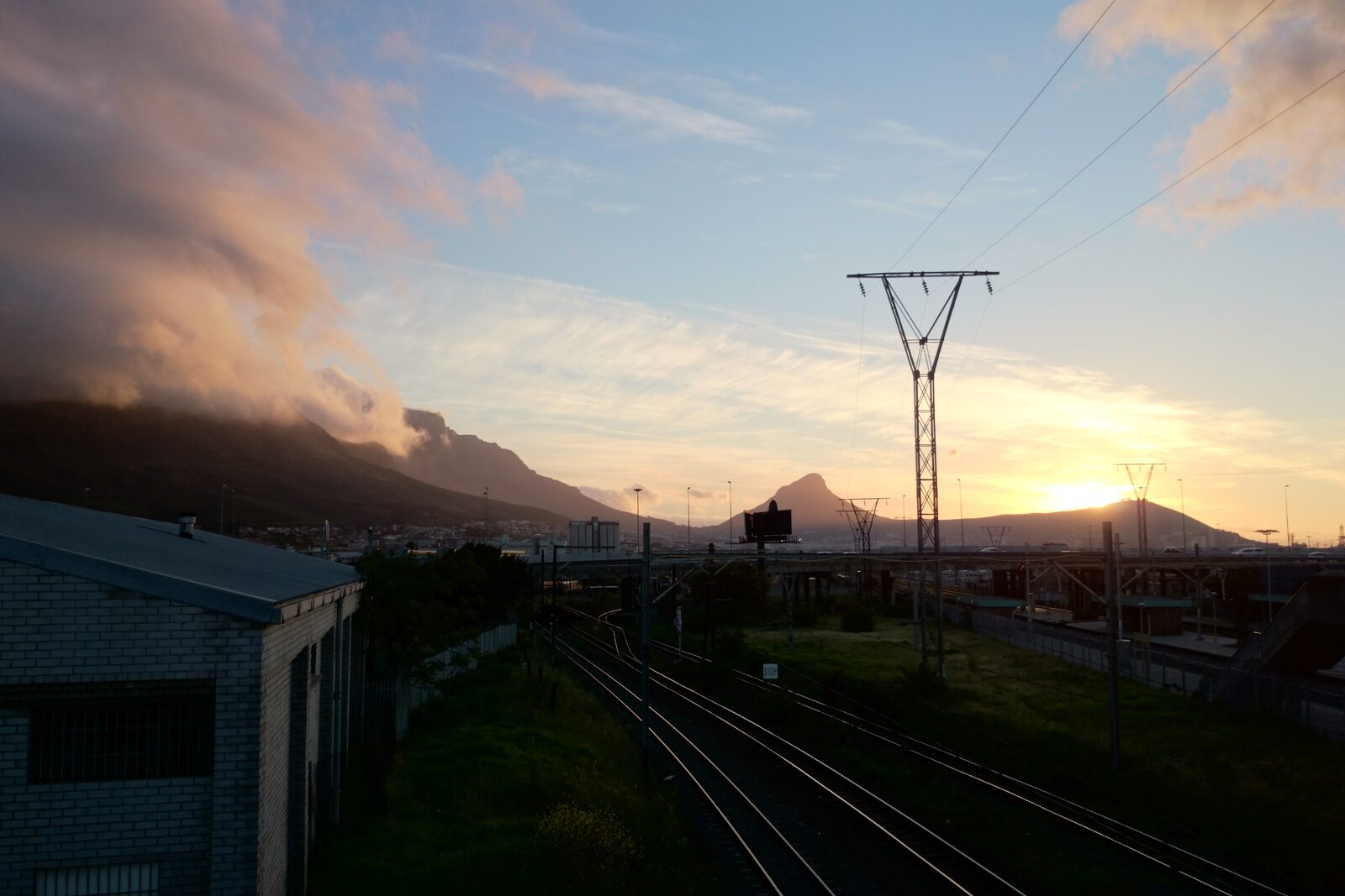 Golden sunset light over Lions Head and Signal Hill seen from across the city