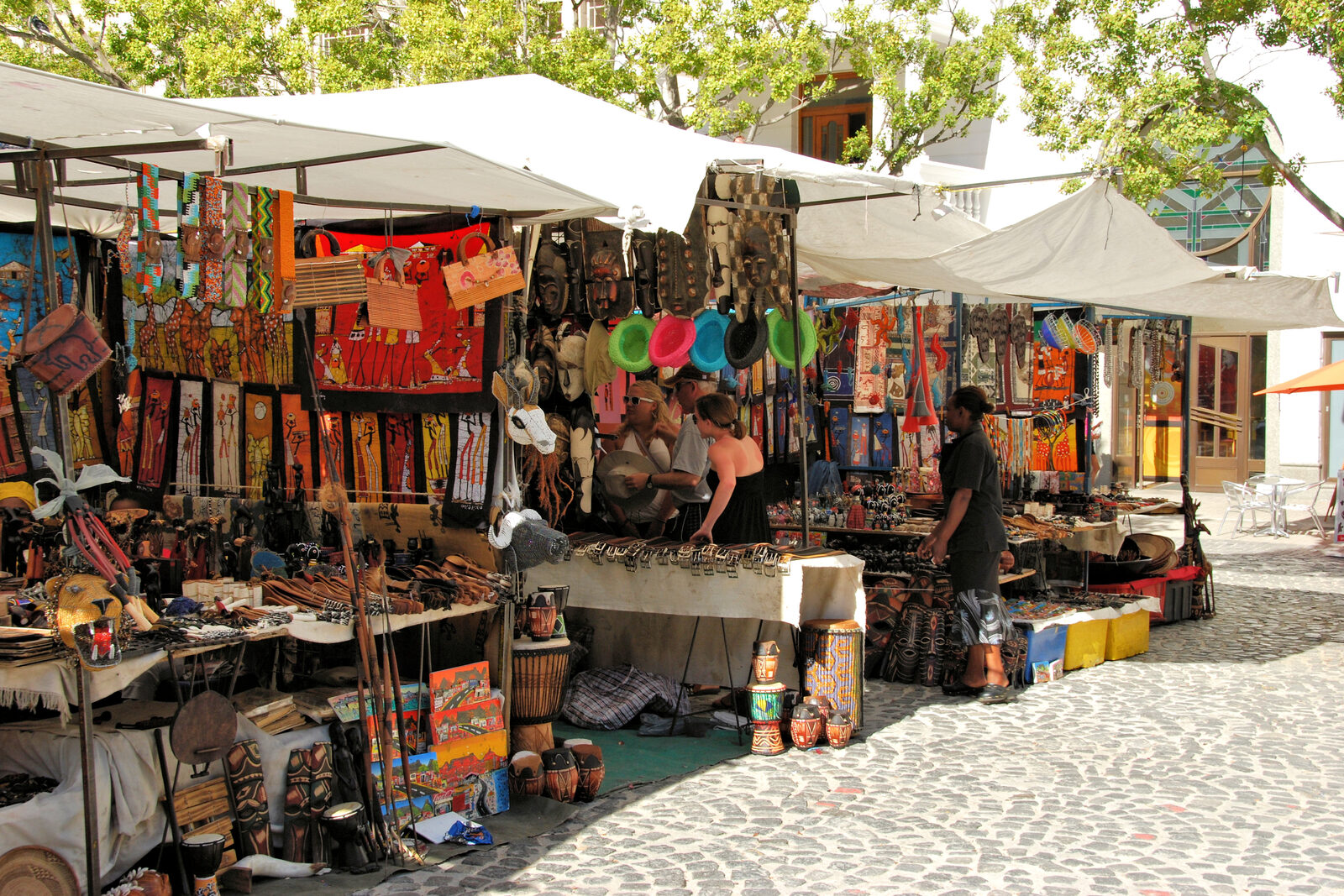 Colourful craft stalls at Greenmarket Square flea market in central Cape Town