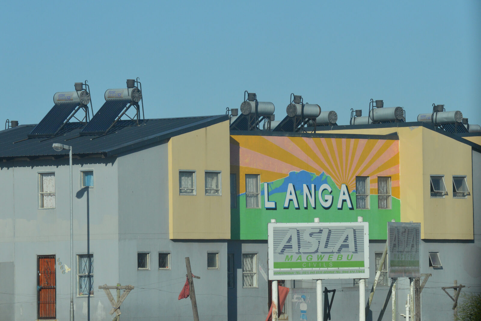 An overview of Langa township in Cape Town with houses and the city skyline behind